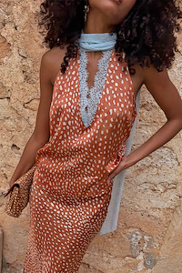 Multi-wear Fawn Lily Top in brown fawn print featuring light blue lace neck ties and a deep V-neckline.