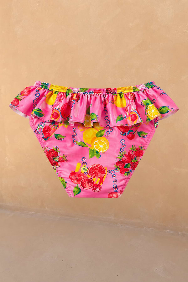 Girls Pink Fruit Bikini Bottoms with a frill waistband and Mediterranean-inspired fruit print.