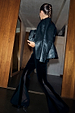 Black Leather Blazer in a relaxed fit, styled with sheer panel velvet flares and a faux fur clutch bag.