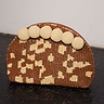 Jaden Beaded Clutch Bag featuring brown and cream patterned beads and statement cream crochet pom-poms.