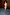 Thumbnail for Gold Vegan Leather Mini Wrap skirt styled with a beige tank top and light blue heels.