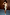 Thumbnail for Gold Vegan Leather Mini Wrap skirt styled with a gold sleeveless top and light blue heels.