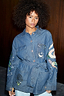 Blue Denim Manifestation Jacket featuring tarot-inspired embroidery and a belted tie waist.