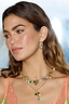 Thumbnail for Gold Plated Balearic Sun Cluster Necklace with iconic motifs and pearls, layered on a model in a lime lace dress.
