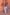Thumbnail for Blue Eye Knitted Cami Top featuring golden eye and heart motifs, styled with light blue jeans against a pink wall.