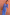 Thumbnail for Blue Eye Mesh Maxi Dress featuring heart motifs, styled with a tan clutch bag and gold jewellery.