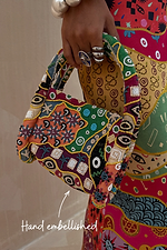 Morocco Beaded Bag featuring hand-beaded abstract patterns in autumnal tones and silver embellishing.