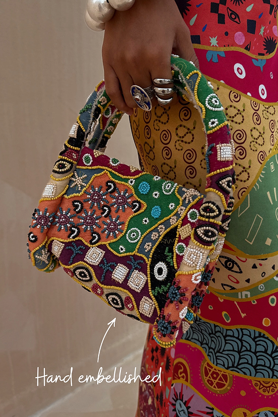 Morocco Beaded Bag featuring hand-beaded abstract patterns in autumnal tones and silver embellishing.