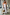 Thumbnail for White Island Cross Stitch Maxi Dress with tropical prints and rope strap detailing in a mirror selfie.