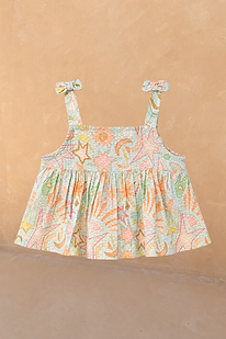 Girl's blue Starburst cotton peplum top with a multi-coloured star and sun print and bow-detailed straps.