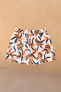 Boy's Banana Print Swim Shorts in cream with orange and blue banana clusters and an elasticated waistband.