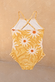 Girl's yellow sun swimsuit with a wavy sun print, featuring thin crossover back straps and soft frill leg details.