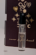 NFD Eau De Parfum 001 2ml tester vial with gold script on a dark celestial illustrated background.