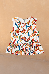 Girl's sleeveless cotton top featuring a multicoloured banana print and a soft peplum frill.