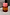 Thumbnail for NFD Eau De Parfum 002 bottle with amber-toned glass, a pink marbled cap, and gold script logo.