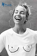 Iconic white Boob T-shirt with line drawing, worn by a laughing woman in support of Mind charity.