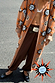 Chocolate Naomi Cargo Trousers in brown satin with a balloon leg, styled with a sun-print cardigan.