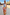 Thumbnail for Abstract Balloon Trousers in a sunset wash of pink and amber, styled for vacation on a sandy beach.