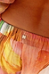 Abstract Balloon Trouser waistband detail showing a sunset wash print, elasticated finish and subtle metallic threads.
