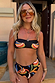 Banana Bandeau Bikini Top in black with colourful embroidered banana motifs, worn for a sunny vacation look.
