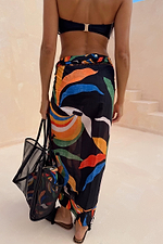 Banana Sarong with a multi-colour banana print on a black base, featuring a wrap tie and lightweight cotton fabric.
