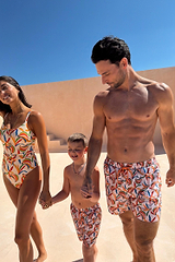Cream Men's Banana Swim Shorts with a multi-coloured print and drawstring, part of a matching family vacation look.