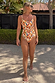 Banana Scoop Swimsuit in cream with a colourful banana print and belted waist, designed in London for vacations.