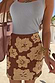 Thumbnail for Jaden Beaded Skirt in brown and cream floral beadwork, styled with a blue ribbed tank top for a vacation look.