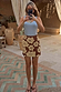 Thumbnail for Brown Jaden Beaded Skirt with cream floral beadwork, styled with a blue ribbed tank top for a holiday look.
