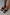 Thumbnail for Black leather stud sandals with a square toe, wide thong strap and silver stud detailing on a model.