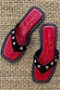Black Leather Stud Sandals featuring a square toe, silver studs and a red footbed, displayed on a woven mat.