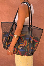 Black Mesh Tote Bag with leather straps and a colourful banana print pouch, styled over a model's shoulder.