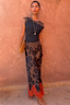 Thumbnail for Black and Chocolate Lace Jersey Top with brown lace trim and Persi floral skirt, a London look against a terracotta wall.