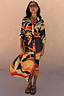 Blue Palm Shirt Dress with vibrant orange and yellow palm motifs, featuring a button-up front and a self-tie waist.