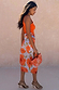 Blue Poppy Jaspre Skirt featuring a vibrant orange poppy print on light blue fabric, styled in an iconic wrap design.