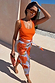 Thumbnail for Iconic Blue Poppy Jaspre Skirt with orange floral print and wrap tie fastening, styled for a sunny vacation look.