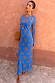 Blue Eye Mesh Dress Petite featuring a heart and eye print and long sleeves, styled with a clutch for vacation.