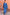 Thumbnail for Blue Eye Mesh Maxi Dress with heart and eye motifs, layered with a matching cardigan and tan clutch.