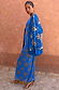 Blue Eye Mesh Dress Petite featuring heart and eye motifs, layered with a matching knit cardigan against a clay wall.