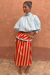 Blue Stripe Batwing Blouse featuring a high neck and shirred cuffs, styled with a red striped skirt.