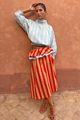 Blue Stripe Batwing Blouse with shirred cuffs and a smocked waist, paired with a red striped ruffled skirt.