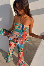 Blue Mari Plisse Bandeau Top in a multi-coloured paisley Mari print, styled with matching trousers for a vacation co-ord.