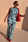 Blue Sun Foldover Trousers in bright blue jersey with sun and swirl motifs, styled with a matching co-ord vest.