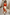 Thumbnail for Blurred Floral Midi Skirt in cream cotton with orange motifs, an A-line silhouette and drawstring waist.