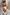 Thumbnail for Blurred Floral Midi Skirt in cream cotton with orange floral print and drawstring waist, designed in London.