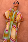 Bright Geo Stevie Maxi Dress with a colourful geometric stripe print and scarf-tie neckline on a model.
