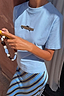 Thumbnail for Blue cotton Cadillac Baby T-Shirt with a retro car motif, styled with a blue striped slip skirt.