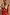 Thumbnail for Red Celestial Midi Dress featuring a sun and hand print, V-neck blouson top and ruffled sleeves on a curve model.
