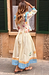 Celestial Talia Skirt in cream cotton with a sun and eye border print, paired with the Nia top.