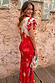 Red Celestial Midi Dress with a cream sun and star print, ruffled sleeves and a bias-cut skirt.